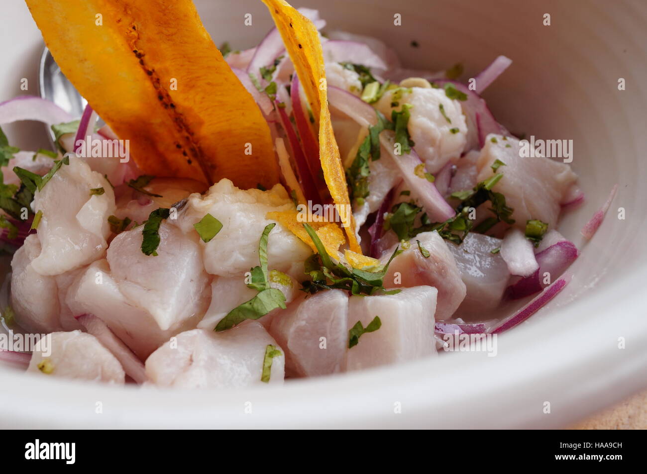 Raw fish ceviche with plantain chips Stock Photo Alamy