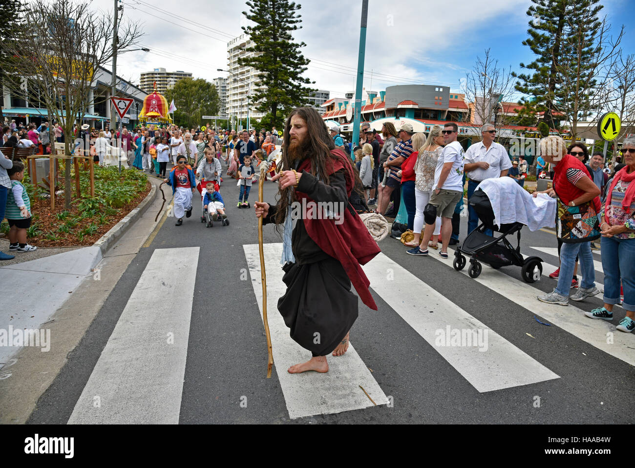 pilgrim leading hare krishna group at 'cooly rocks on' parade at coolangatta at the gold coast queensland australia Stock Photo