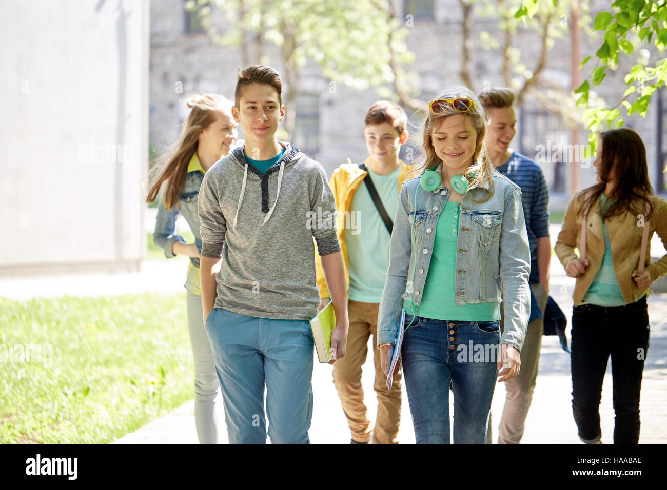 group of happy teenage students walking outdoors Stock Photo - Alamy
