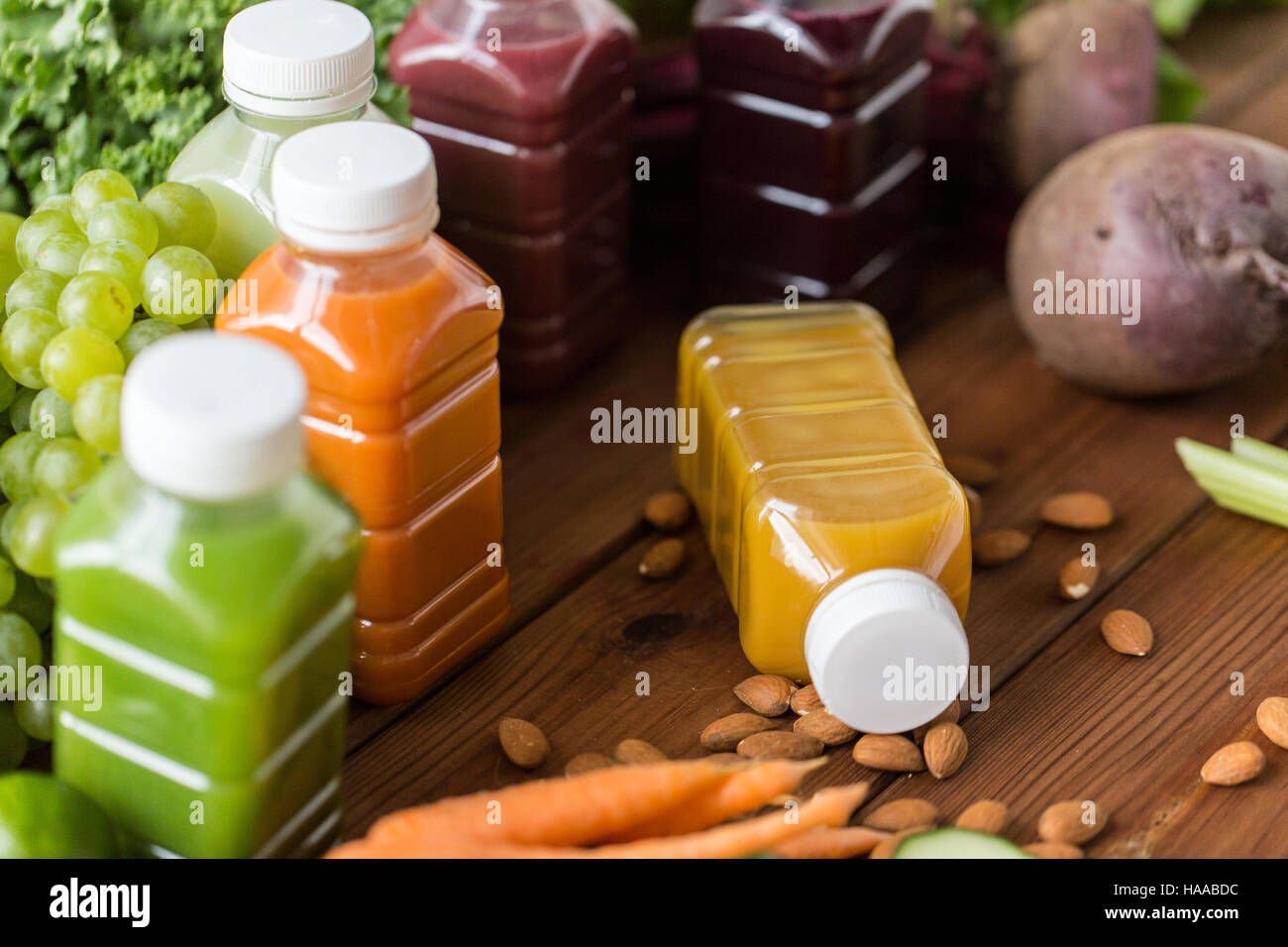bottles with different fruit or vegetable juices Stock Photo Alamy