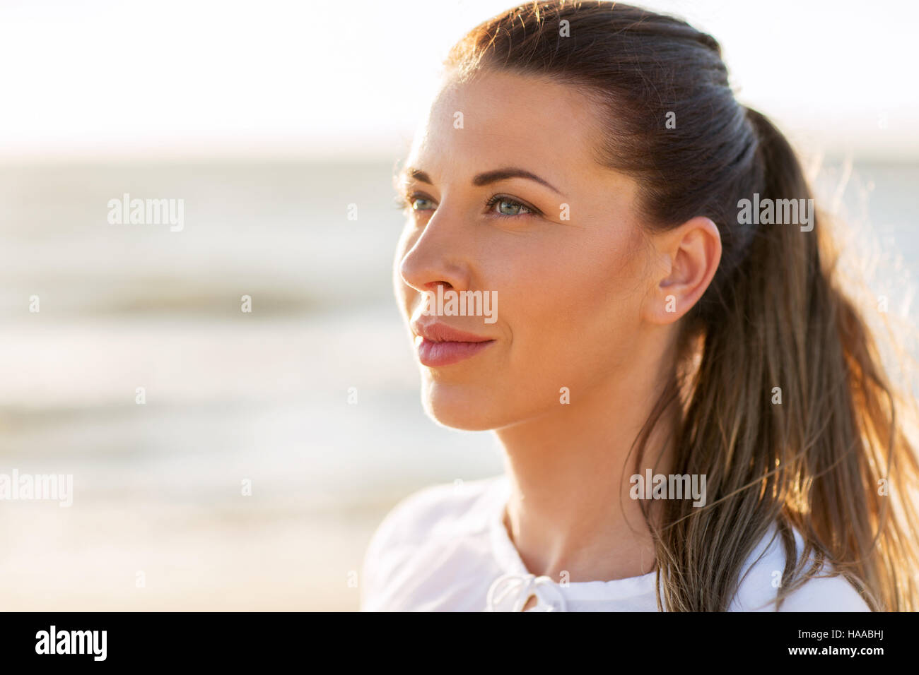 happy smiling young woman face outdoors Stock Photo - Alamy