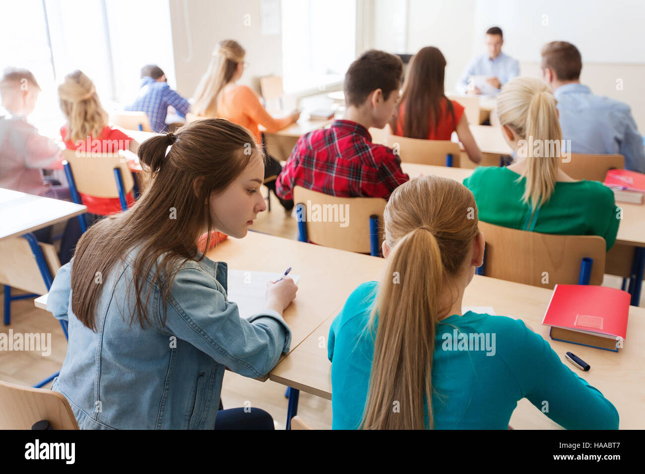 group of students writing school test Stock Photo