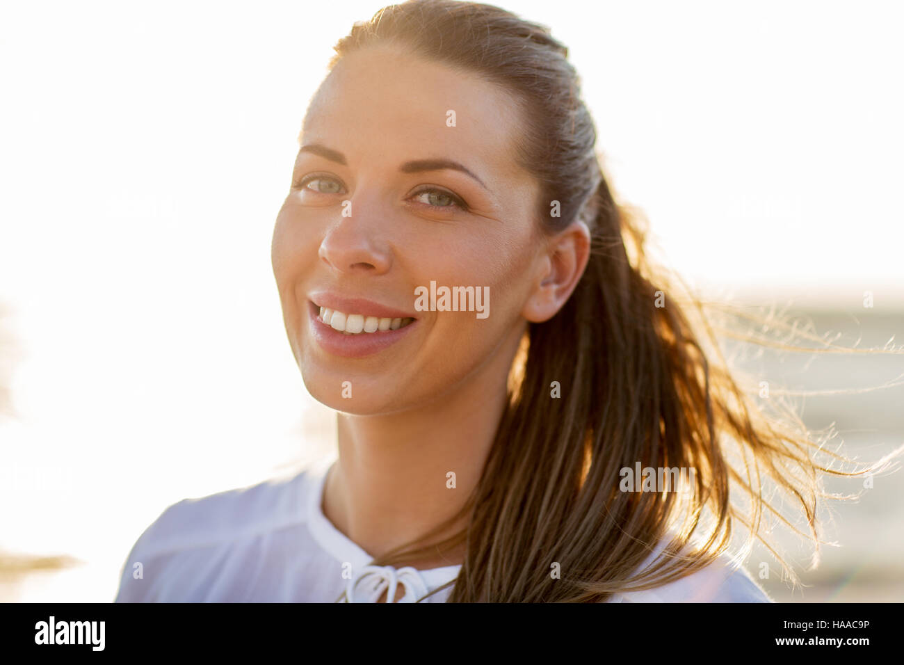 happy smiling young woman face outdoors Stock Photo - Alamy