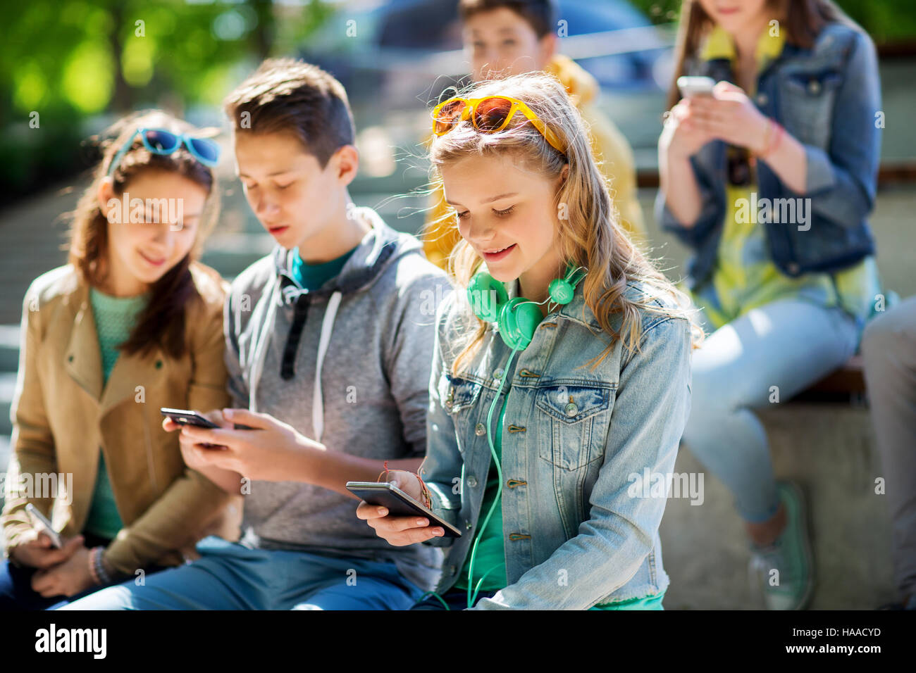 happy teenage girl with smartphone and headphones Stock Photo - Alamy