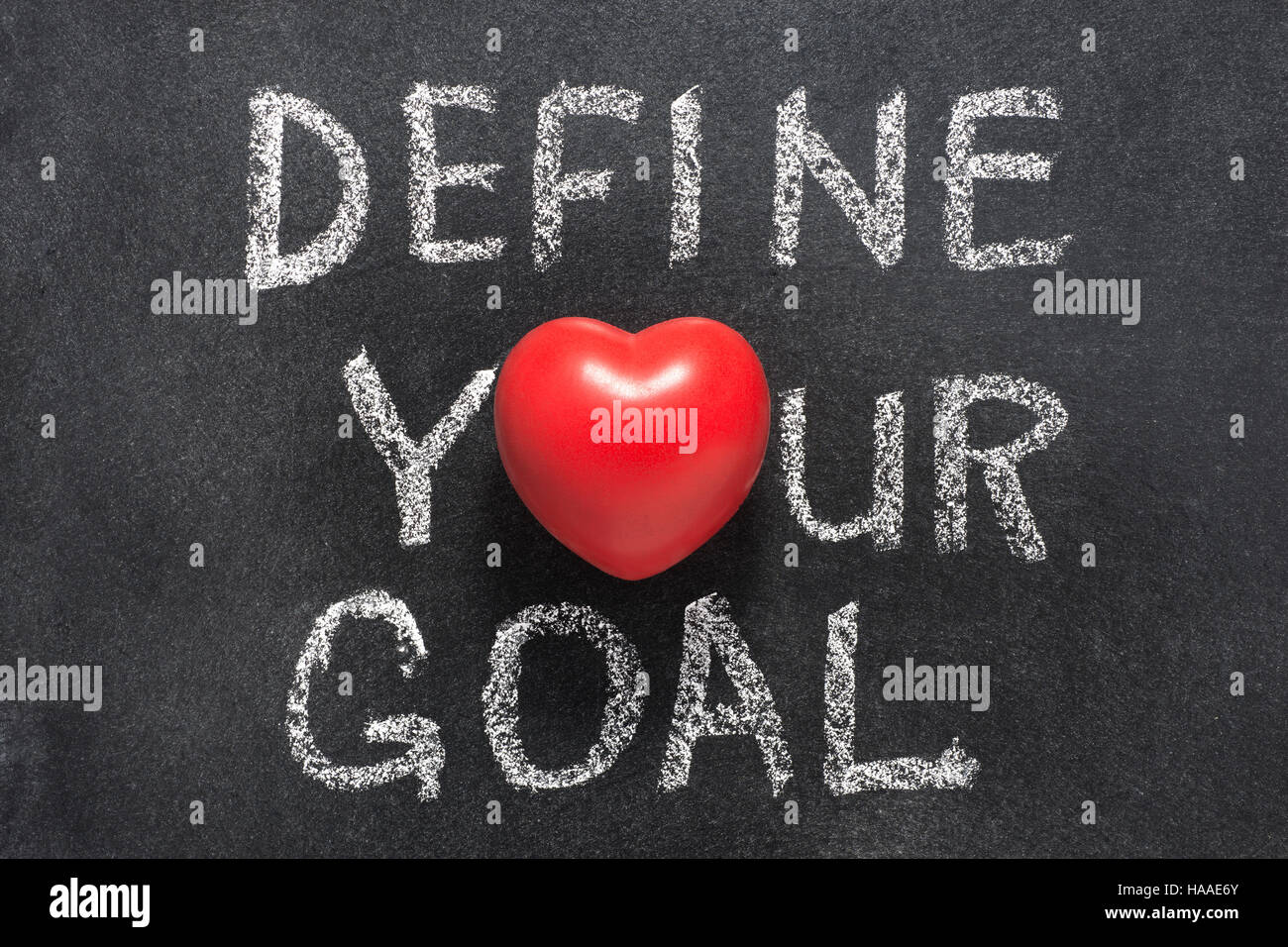 define your goal phrase handwritten on blackboard with heart symbol instead of O Stock Photo