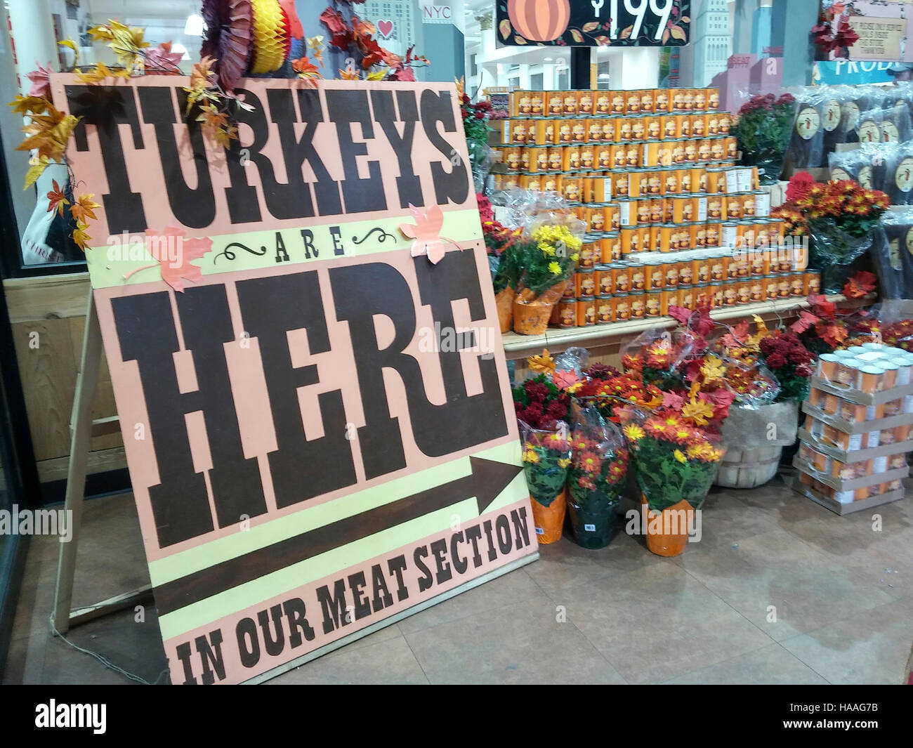 A sign announces that Trader Joe's house brand turkeys have arrived in