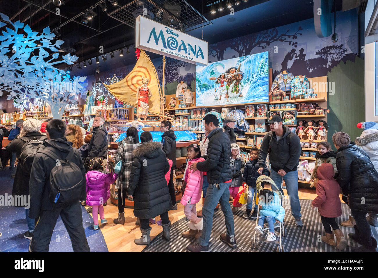 The Disney Store in Times Square in New York promotes merchandise tied to its latest release, 'Moana', seen on Saturday, November 26, 2016. Playing in 3875 locations 'Moana' appears to be the winner of the Thanksgiving movie sweepstakes already earning $21.8 million with an estimate of over $80 million by the time the holiday weekend ends. And that's just box office, it doesn't include the obligatory merchandising that goes along.  (© Richard B. Levine) Stock Photo