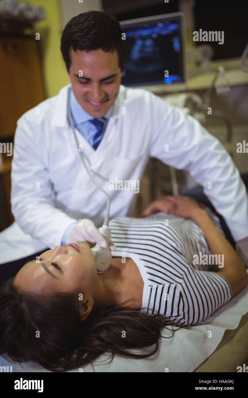 Female patient receiving a ultrasound scan on the neck Stock Photo