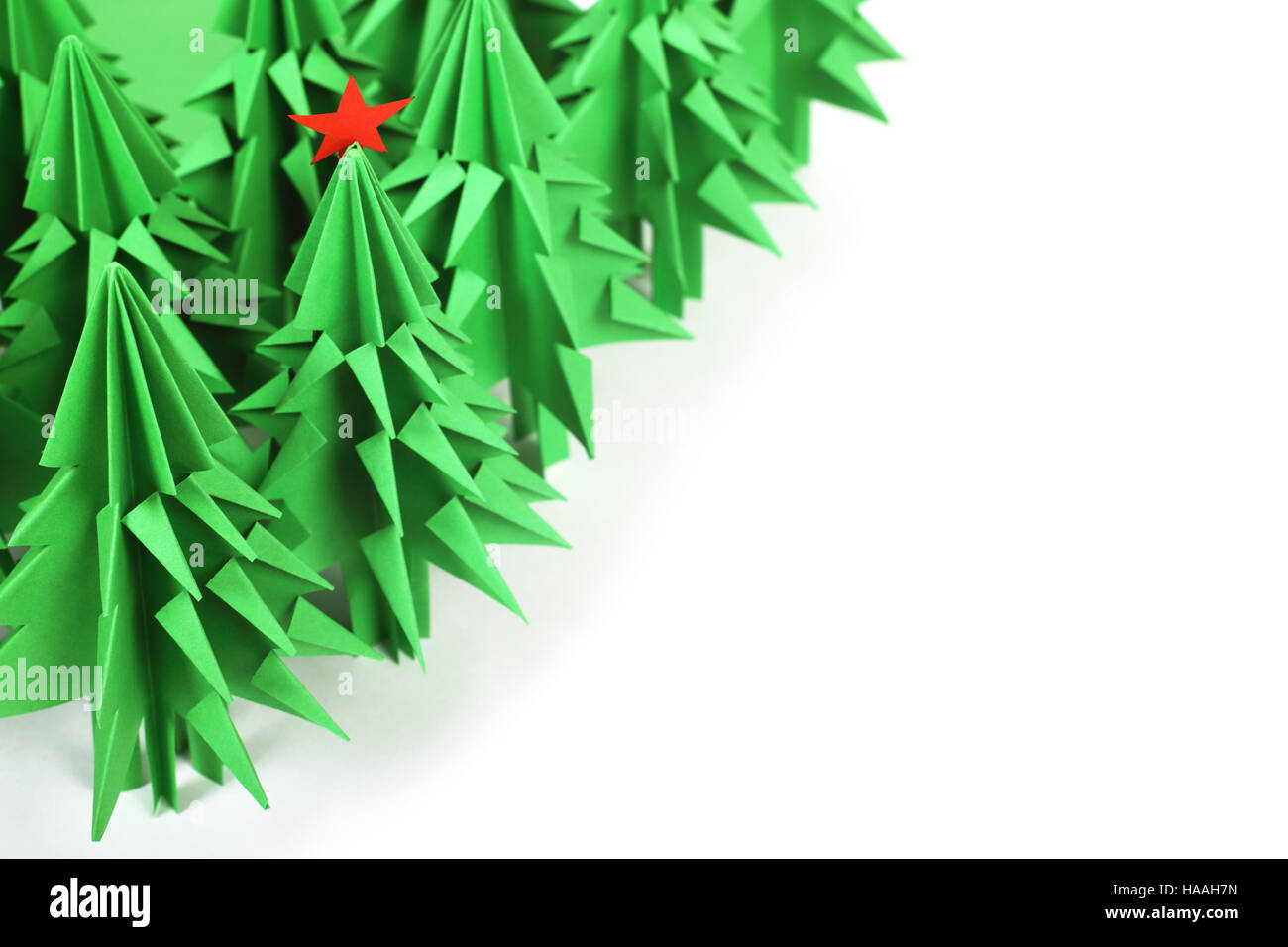 Green origami christmas trees isolated on white background Stock Photo ...