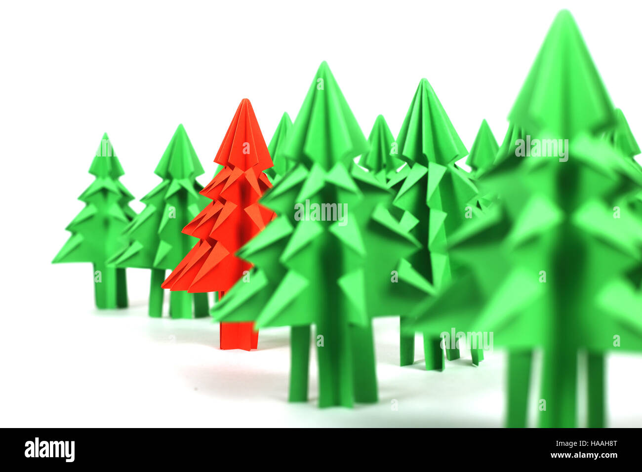 Green and red origami christmas trees isolated on white background ...