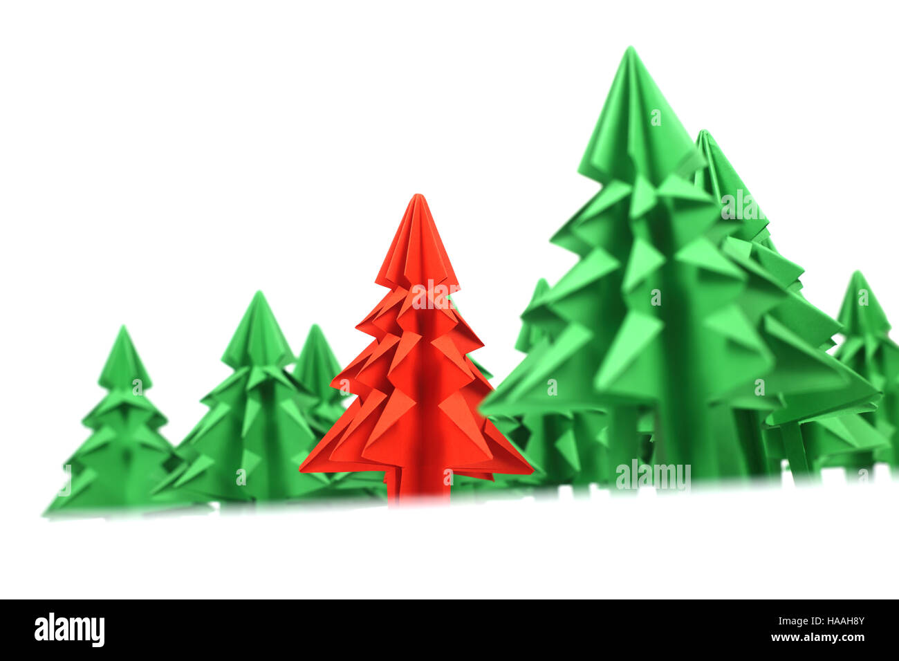 Green and red origami christmas trees isolated on white background ...