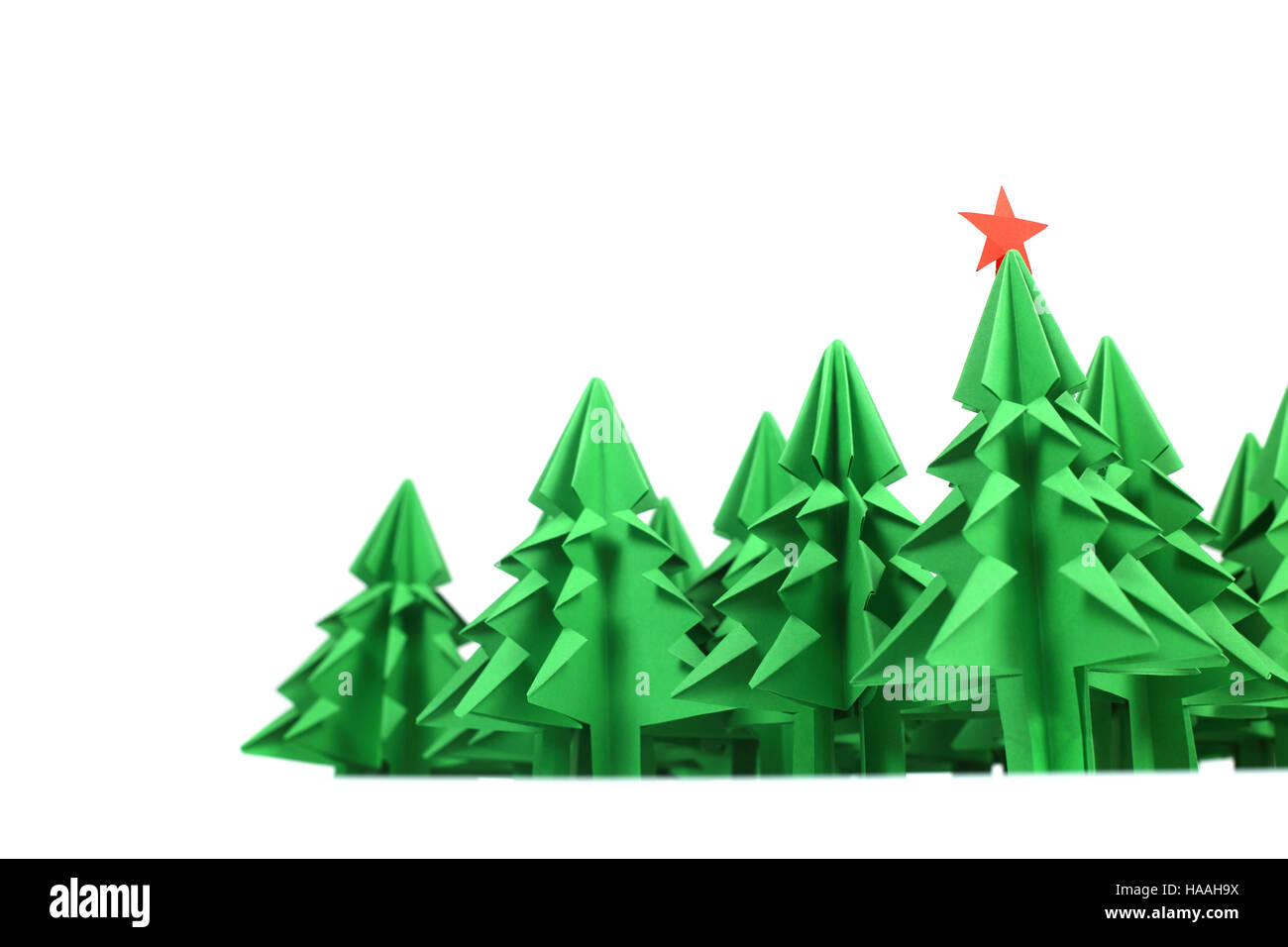 Green origami christmas trees isolated on white background Stock Photo ...