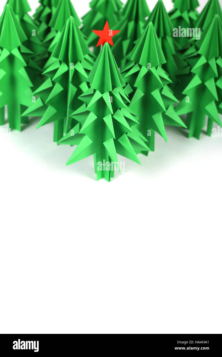 Green origami christmas trees isolated on white background Stock Photo ...