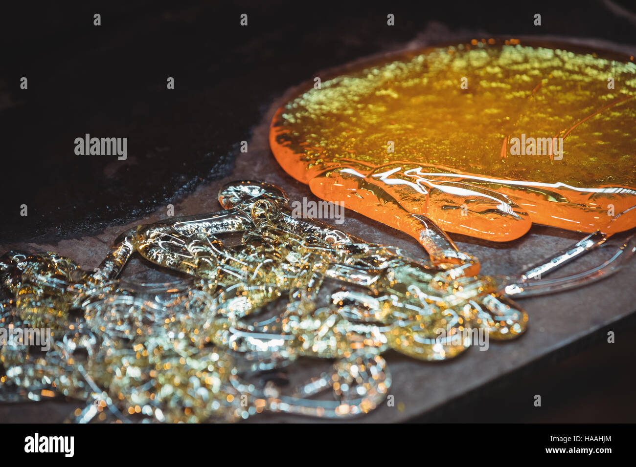 Molten glass at glassblowing factory Stock Photo