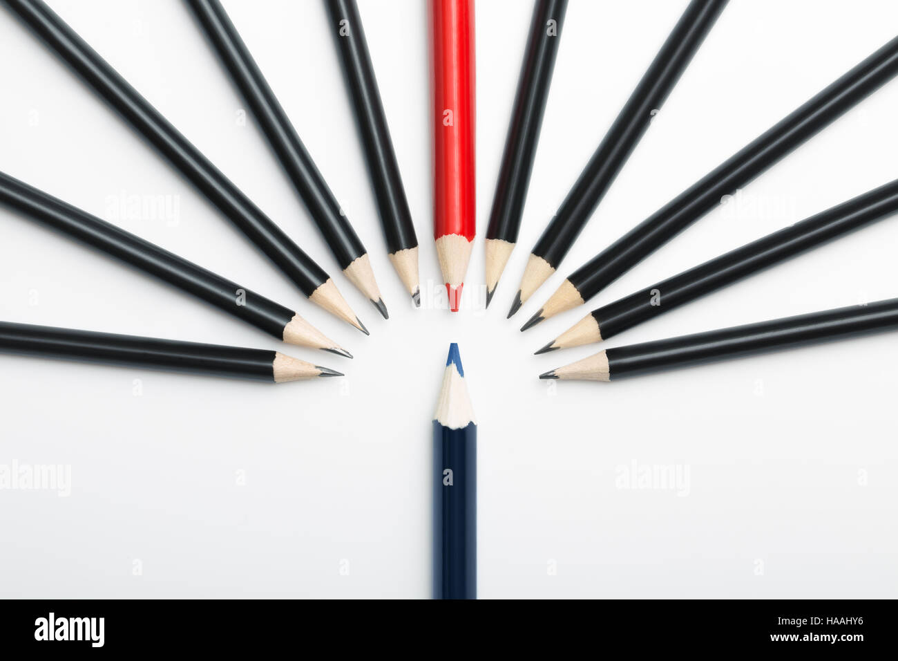 one blue pencil against all black with red leader. Abstract gay discrimination Stock Photo