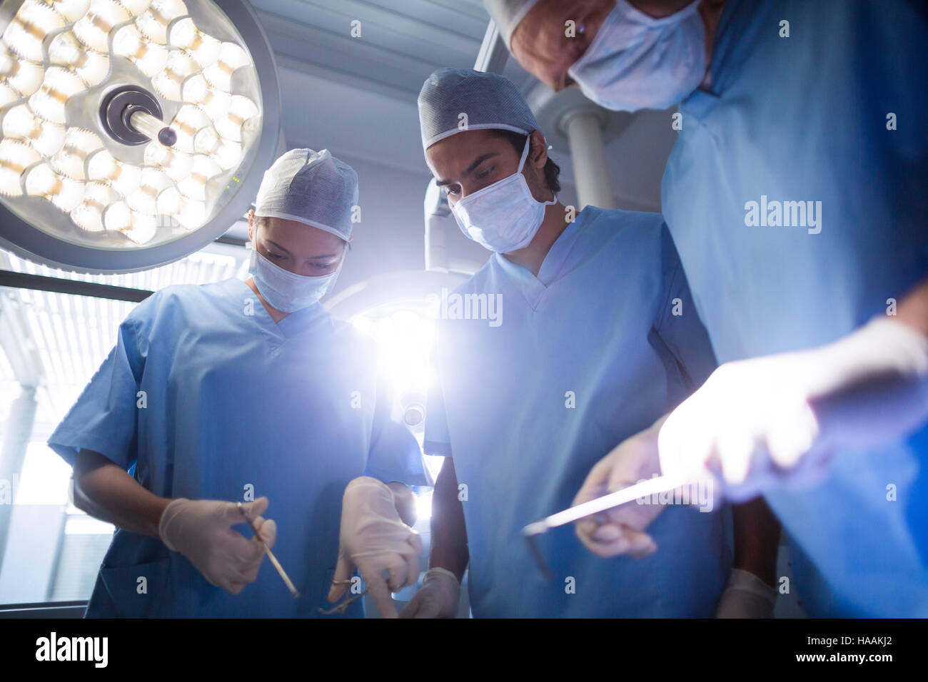 Group of surgeons performing operation in operation room Stock Photo ...