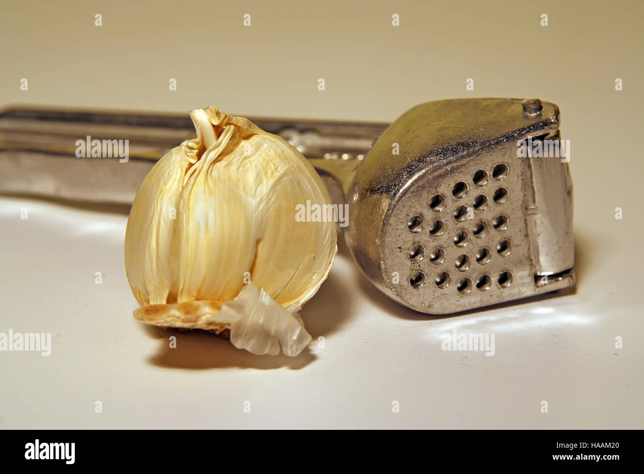 Garlic squasher. Kitchen tool. Garlic mashing tool. Stock Photo