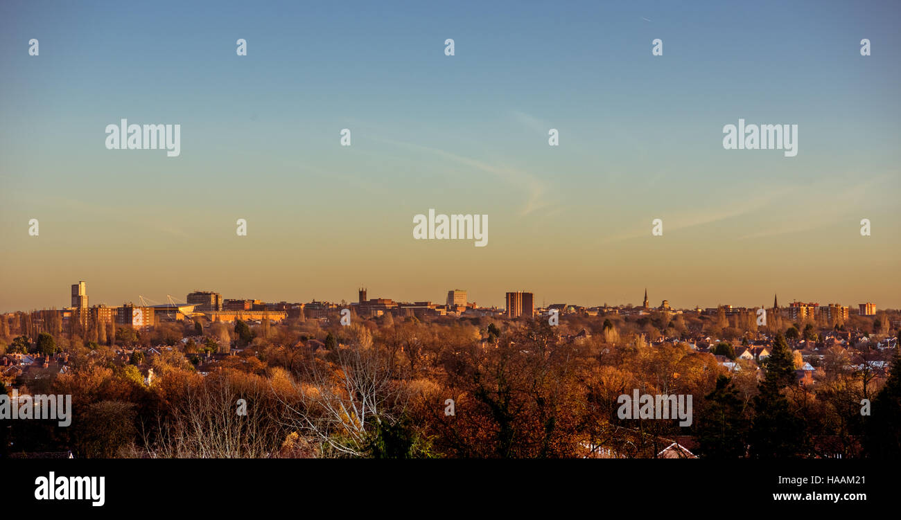 View of Wolverhampto horizon as the sun rises showing landmarks including St Peter's Church, the Molineux and city centre buildings and house rooftops Stock Photo