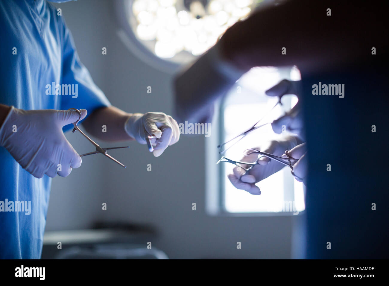 Group of surgeons performing operation in operation room Stock Photo ...