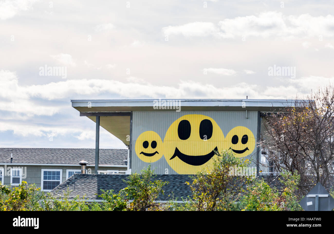 happy faces on the side of a commercial building in Montauk NY Stock Photo