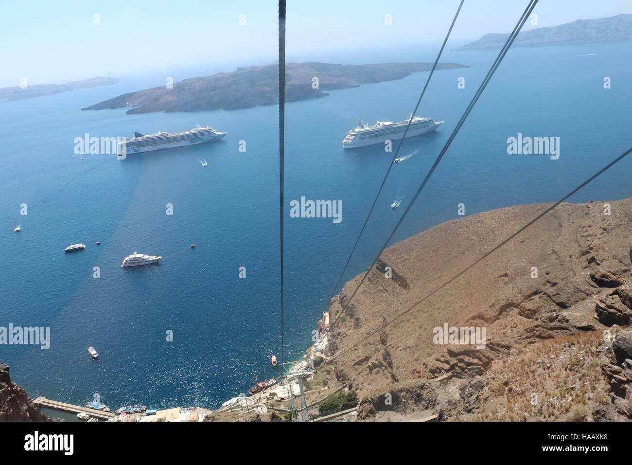 View from the top of the cable cars down into the sea, showing  the depth and drop from the top, in Santorini, Greece Stock Photo