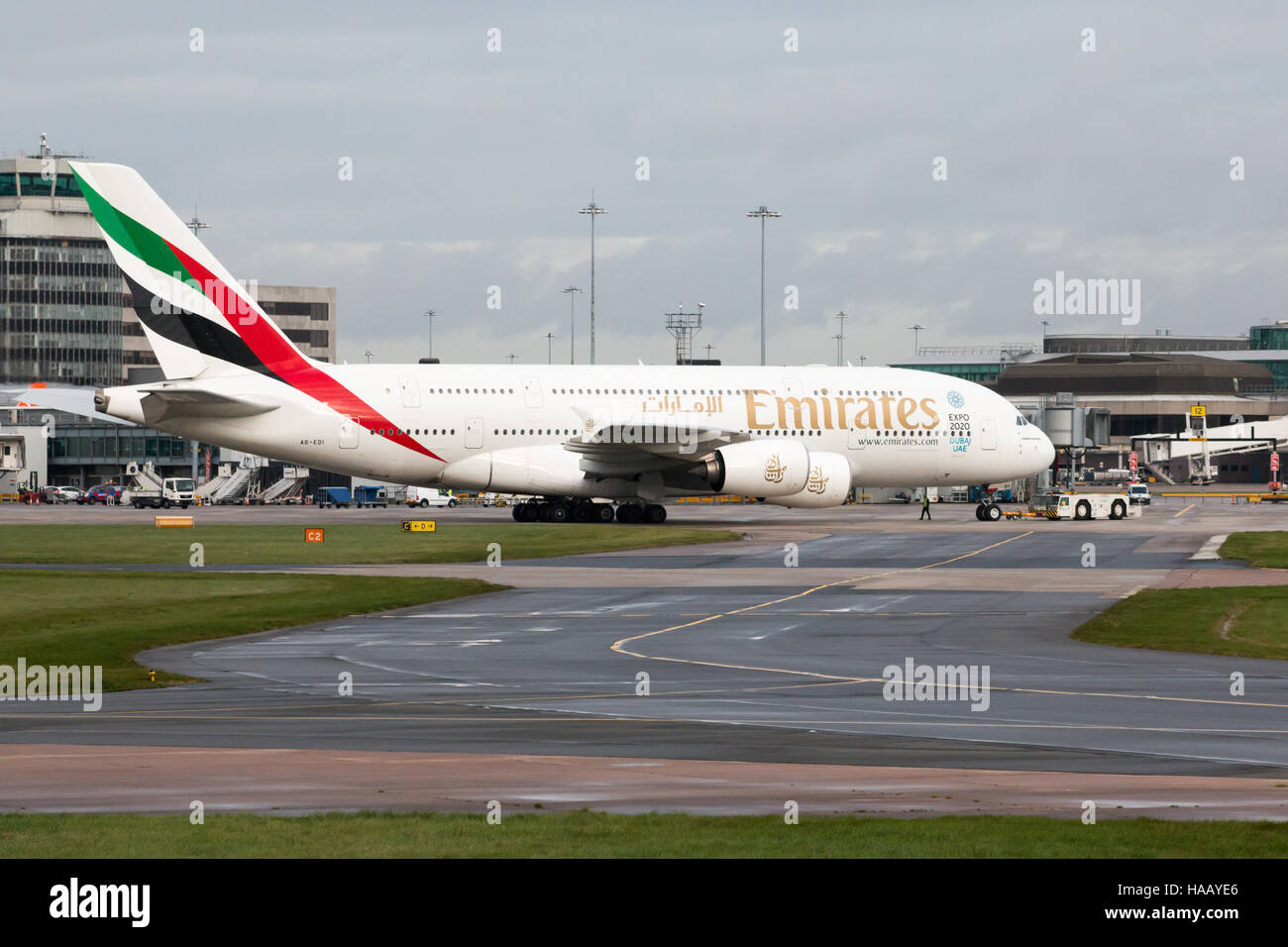 Emirates A380-861 double-decker wide-body passenger plane (A6-EDI) taxiing on Manchester International Airport tarmac. Stock Photo