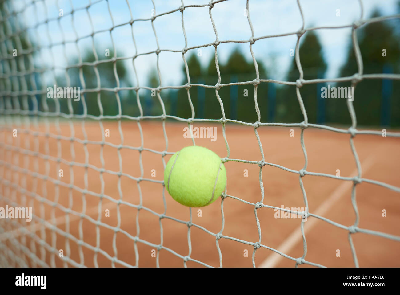 Tennis ball is hitting the net Stock Photo