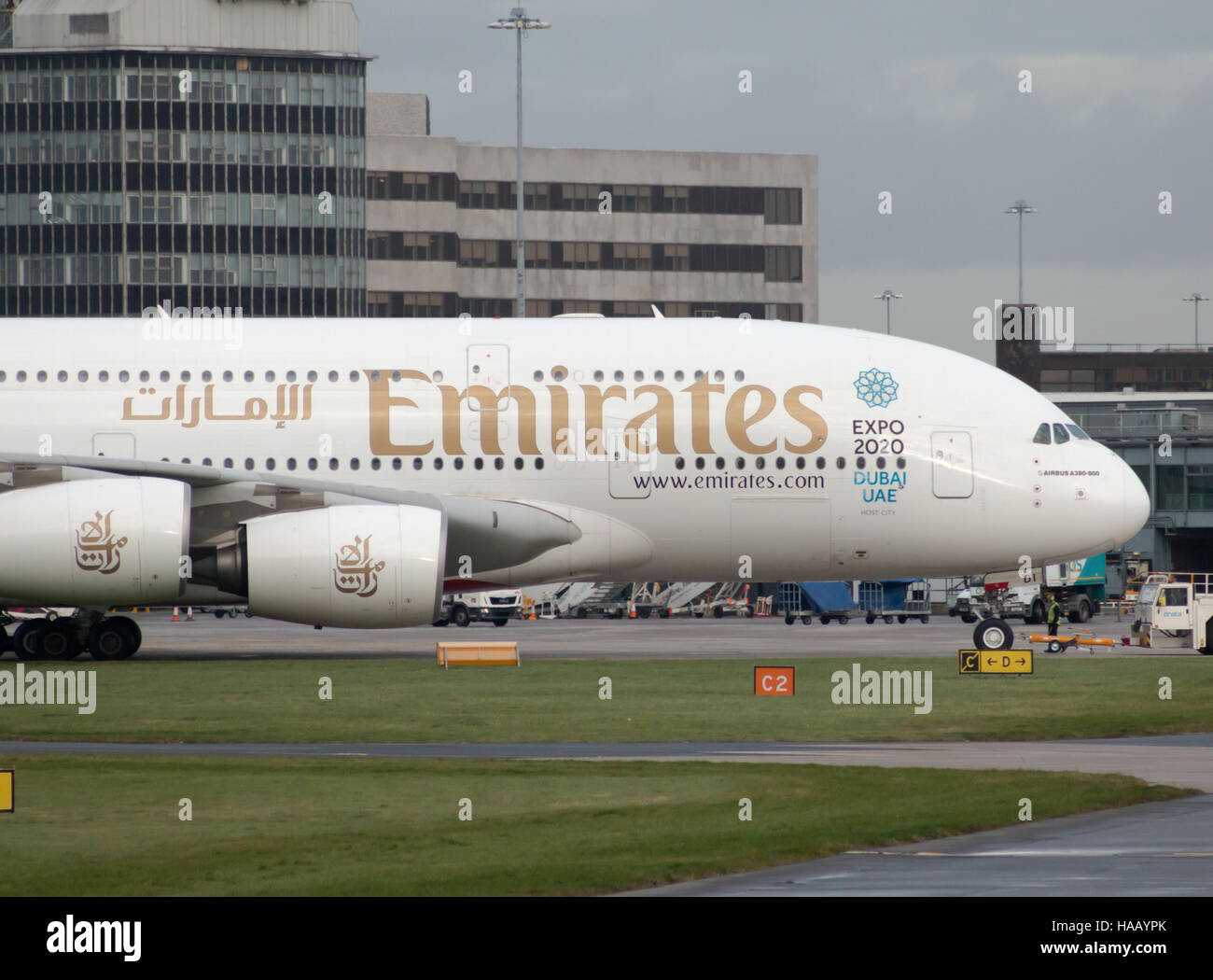 Emirates A380-861 double-decker wide-body passenger plane (A6-EDI) taxiing on Manchester International Airport tarmac. Stock Photo