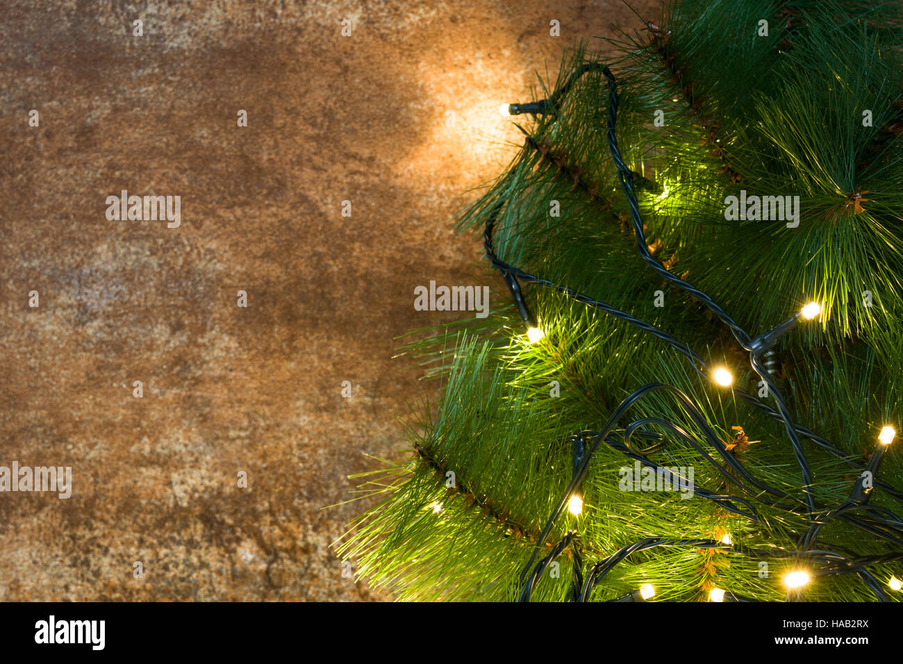 Christmas tree and lights on rusty background Stock Photo Alamy
