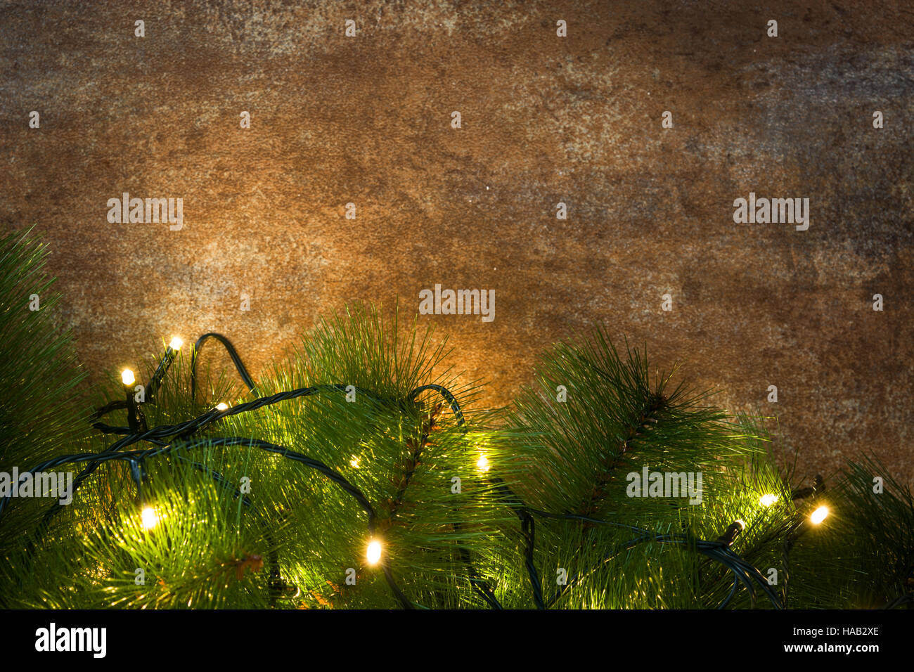 Christmas tree and lights on rusty background Stock Photo Alamy