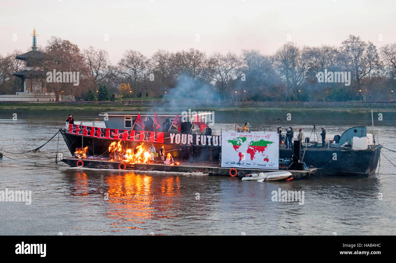 Joe Corre burns his £5 million pound collection of punk memorabilia in protest to declare 'punk is dead'. The burning took place on a barge on Chelsea Embankment. Stock Photo