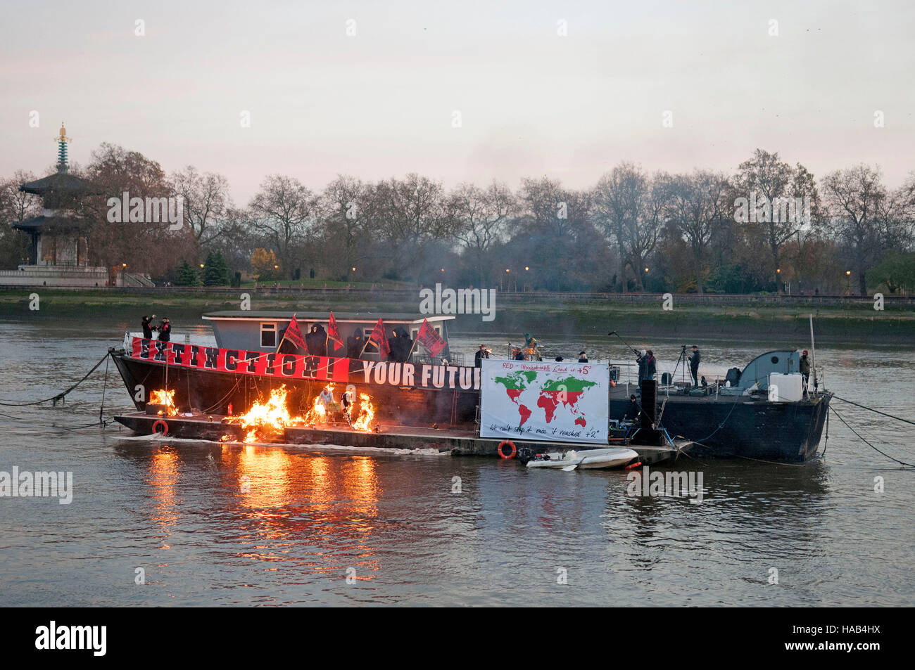 Joe Corre burns his £5 million pound collection of punk memorabilia in protest to declare 'punk is dead'. The burning took place on a barge on Chelsea Embankment. Stock Photo