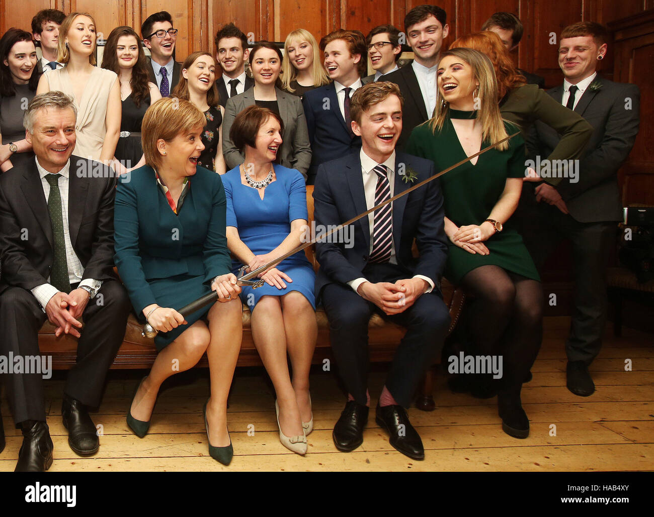 Scottish First Minister Nicola Sturgeon (front, second left) and the Provost of Trinity College Dublin, Patrick Prendergast (front left) are joined by 22 members of the Philosophical Society at Trinity College Dublin before she received an honorary patronage from the the college. Stock Photo