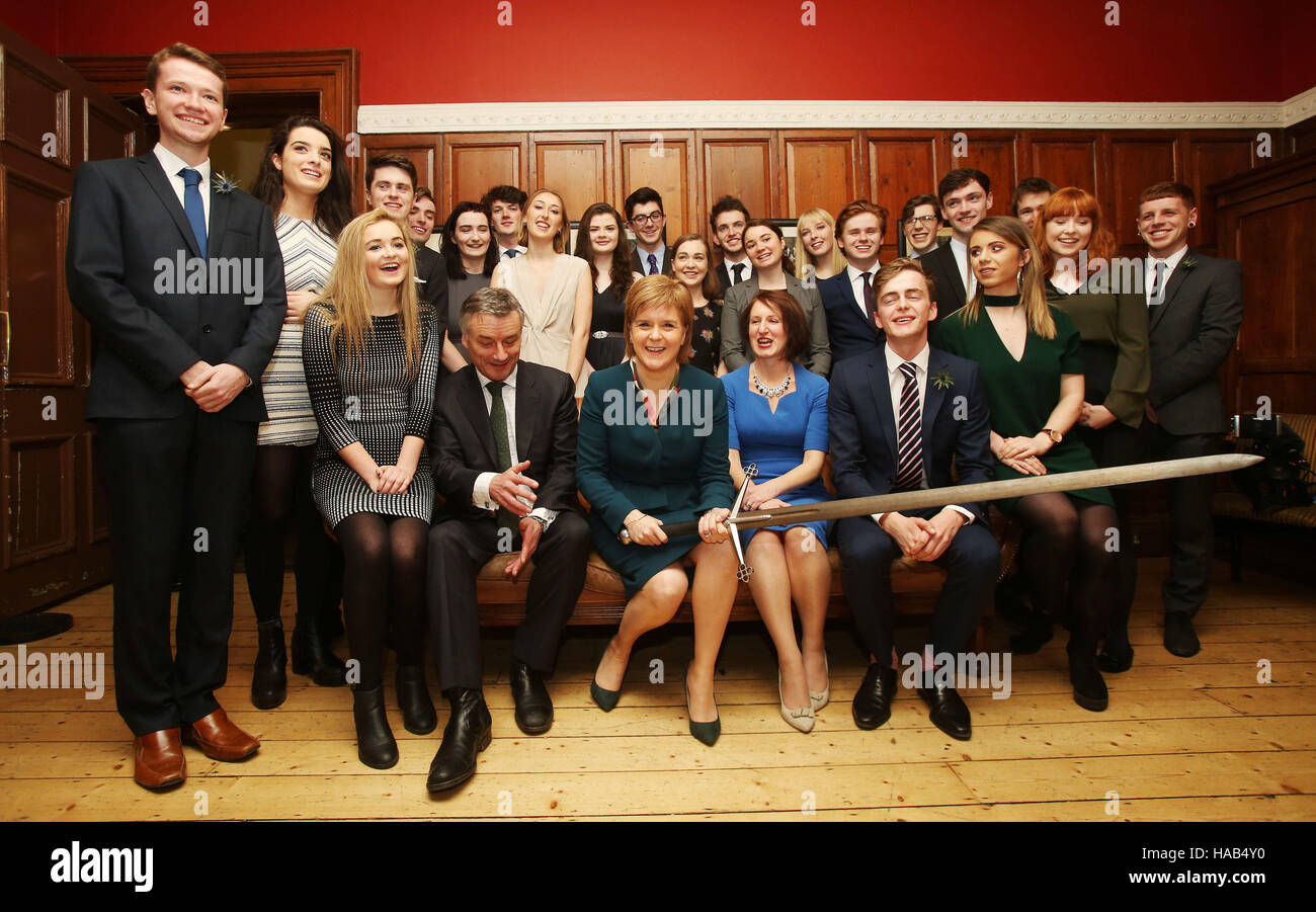 Scottish First Minister Nicola Sturgeon (front row, third left) and the Provost of Trinity College Dublin, Patrick Prendergast (front row, second left) are joined by 22 members of the Philosophical Society at Trinity College Dublin before she received an honorary patronage from the the college. Stock Photo