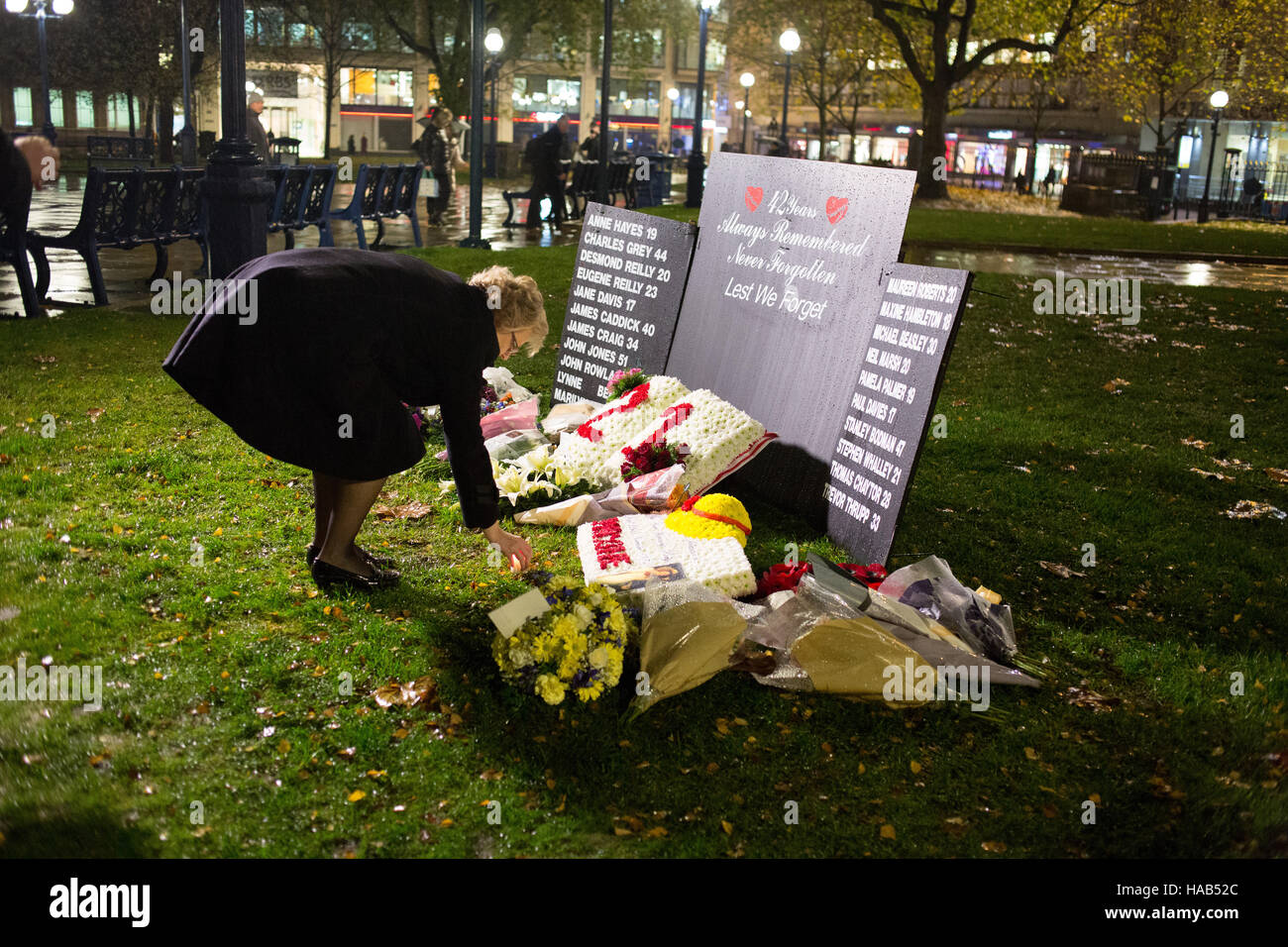 Julie Hambleton sister of Maxine who was murdered in the Birmingham Pub Bombings lays a candle on the 42nd anniversary. Stock Photo