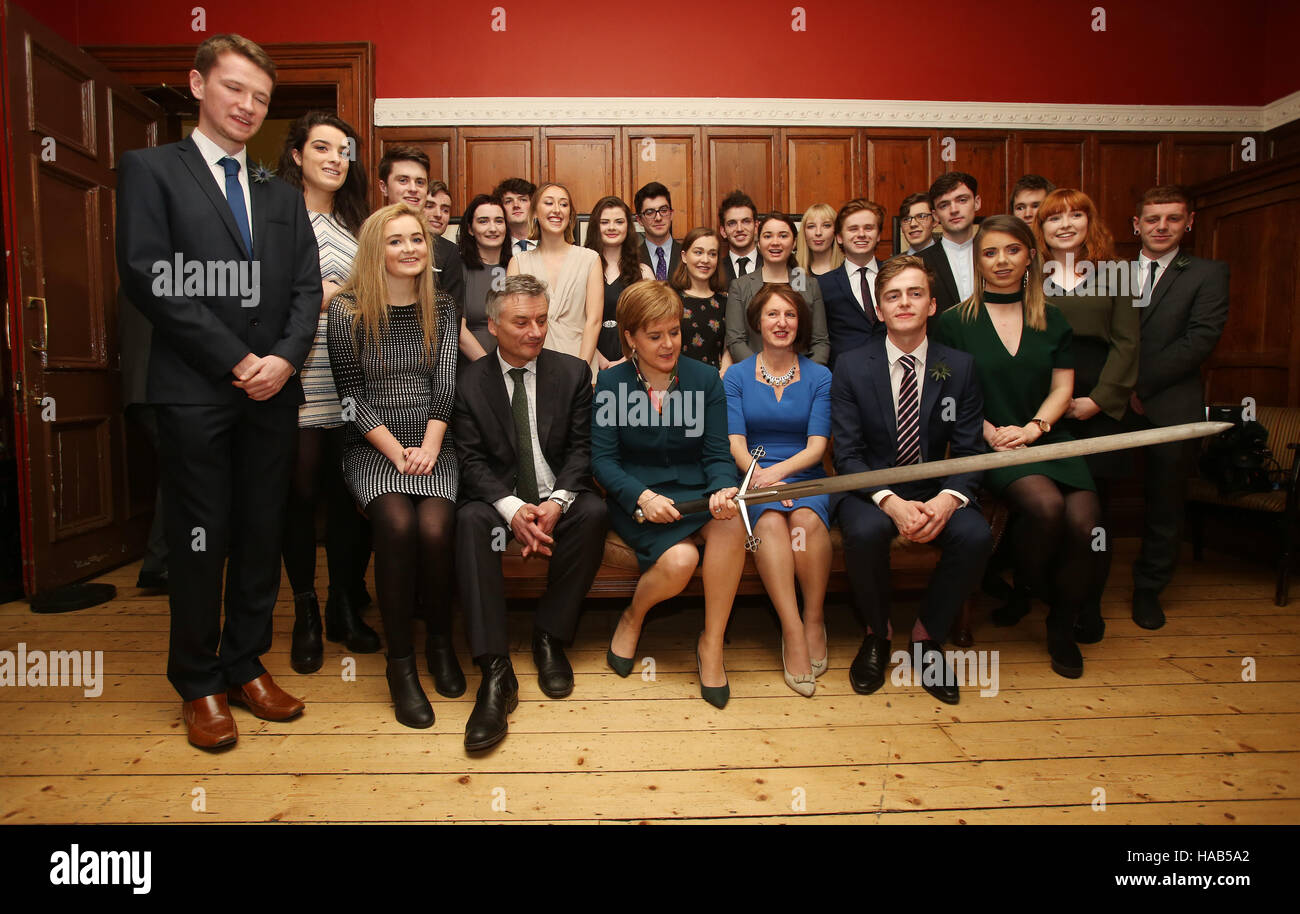 Scottish First Minister Nicola Sturgeon (front row, third left) and the Provost of Trinity College Dublin, Patrick Prendergast (front row, second left) are joined by 22 members of the Philosophical Society at Trinity College Dublin before she received an honorary patronage from the the college. Stock Photo