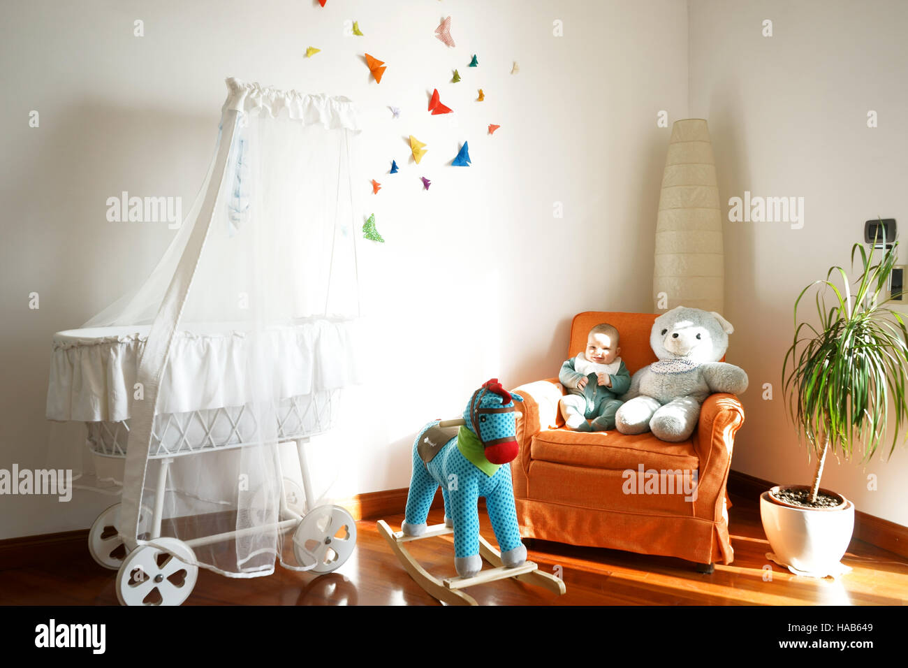 Baby room - decor with butterfly origami and toys Stock Photo - Alamy