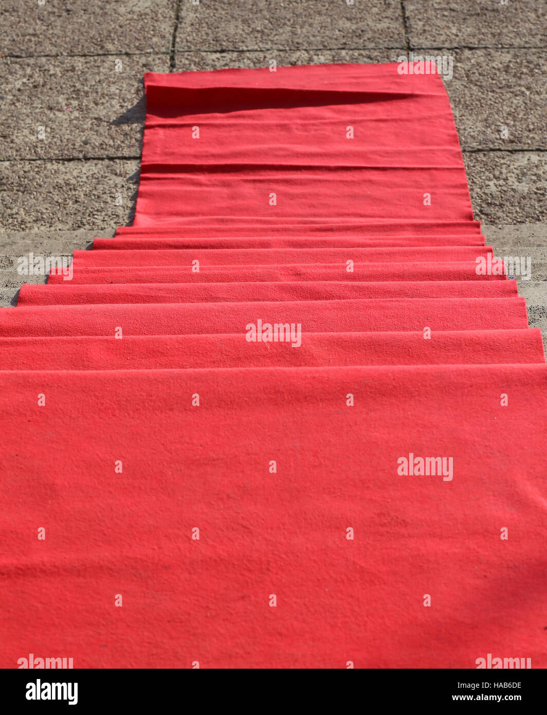 elegant long red carpet on the stairs at the vip fashion event Stock Photo