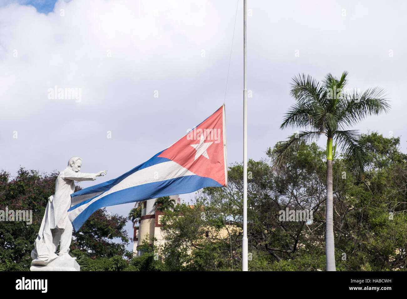 La Havana, Cuba, 26 November 2016. Scenes around the old town of La Havana on the day Castros death was announced. Cuban flag at half mast with the statue of Jose Marti in the Parque Central in La Havana. Stock Photo