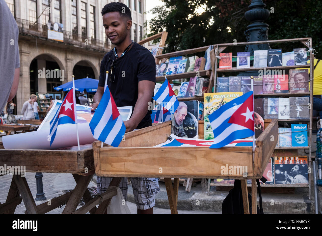 La Havana, Cuba, 26 November 2016. Scenes around the old town of La Havana on the day Castros death was announced. Cuban flags on the book and poster stalls in the Plaza Armas. Stock Photo