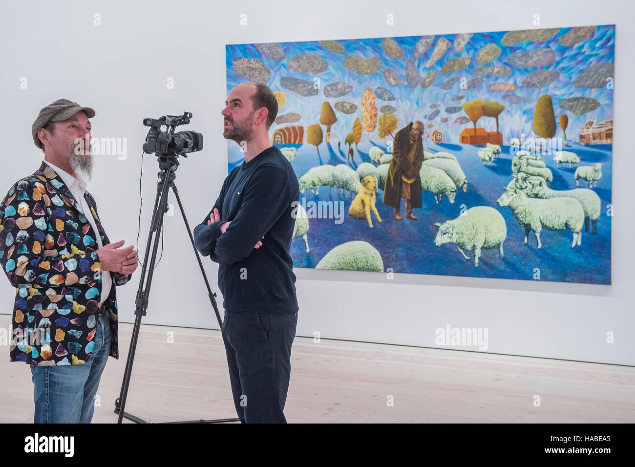 London, UK. 29th Nov, 2016. Gainsborough farm by David Brian Smith (pictured being interviewed) - PAINTERS' PAINTERS: Artists of today who inspire artists of tomorrow, featuring the work of nine present-day painters ranging from their 30s to their 60s at the Saatchi Gallery. There are nine artists included in the exhibition, whose aim is to start a discussion about the importance of painting and its future as a contemporary art form, given that installation, sculpture and video dominate the art world. Credit:  Guy Bell/Alamy Live News Stock Photo