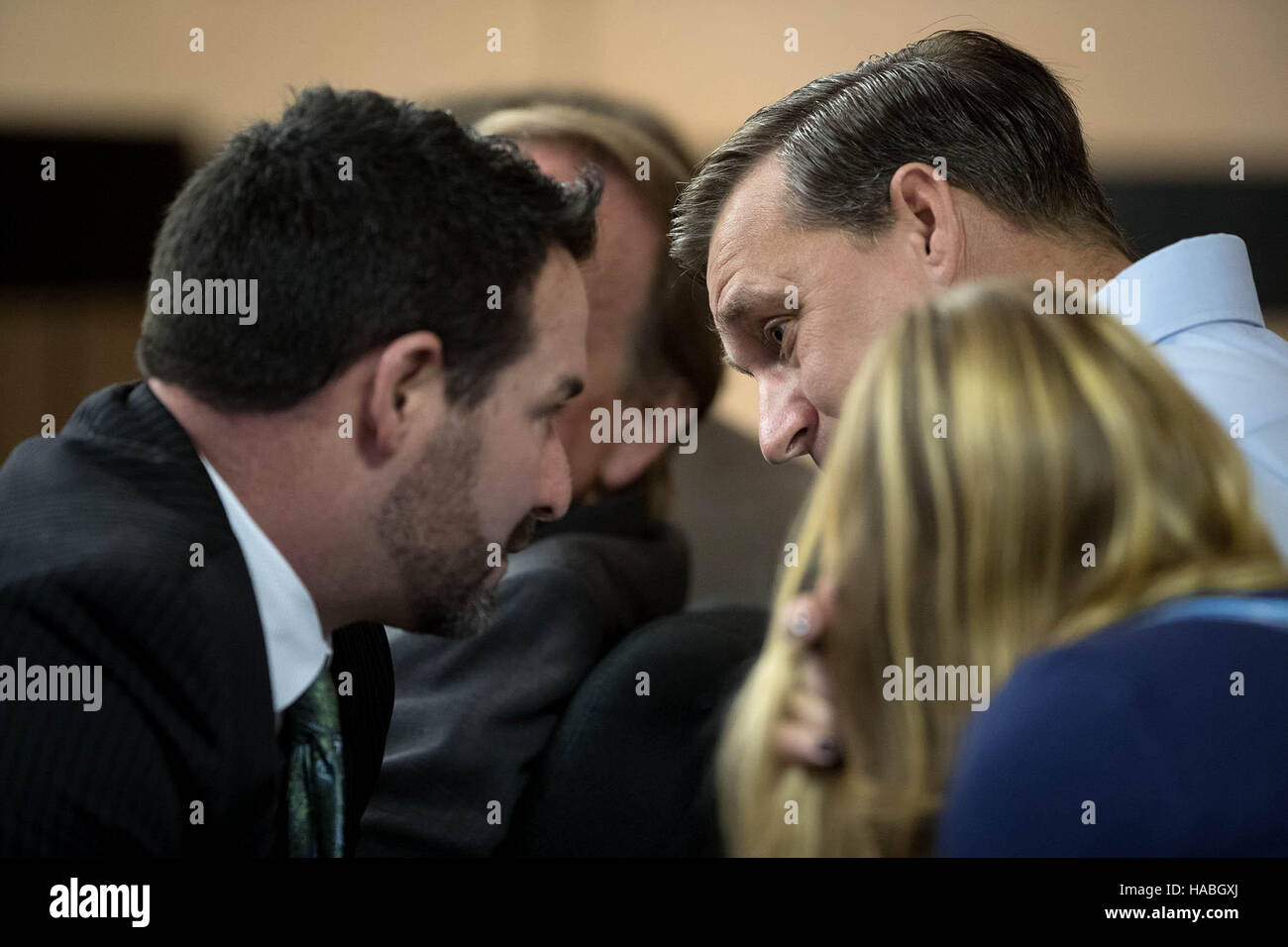 West Palm Beach, Florida, USA. 29th Nov, 2016. Blu Stephanos, the father of Austin Stephanos, (right) and his mother, Carly Black, (foreground) talk with attorney Mike Pike (left) during a hearing at the Palm Beach County Courthouse in West Palm Beach, Florida on November 29, 2016. Perry Cohen's father has filed a bill of discovery to allow release of the electronic information. Attorneys for Perry Cohen's mother Pamela, as well as Blu Stephanos and Carly Black - the parents of Austin - want the bill of discovery denied. © Allen Eyestone/The Palm Beach Post/ZUMA Wire/Alamy Live News Stock Photo
