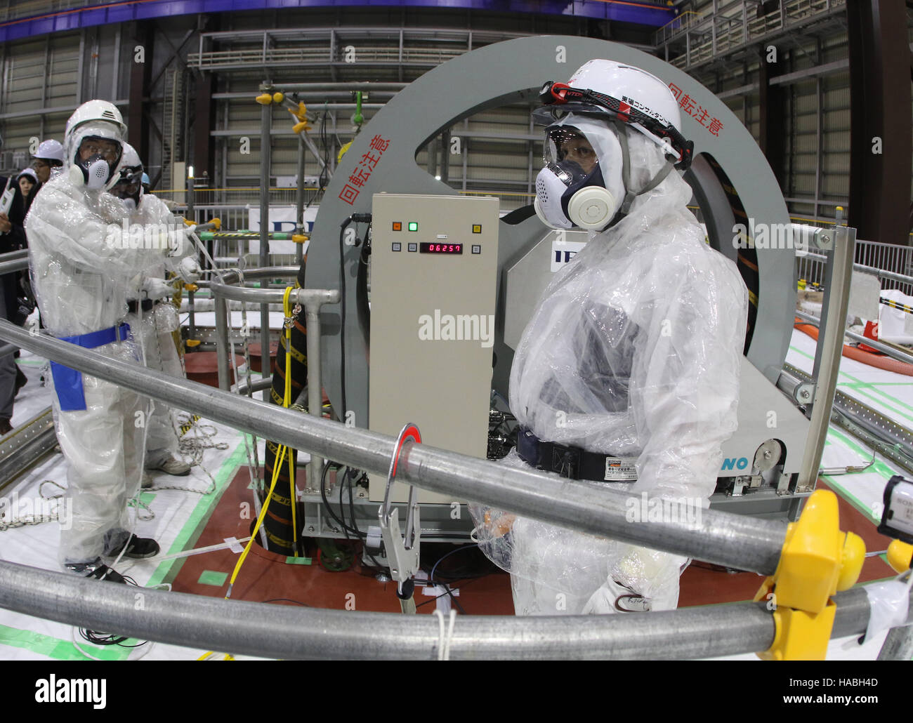 Naraha, Japan. 29th Nov, 2016. Workers in radiation protection suits