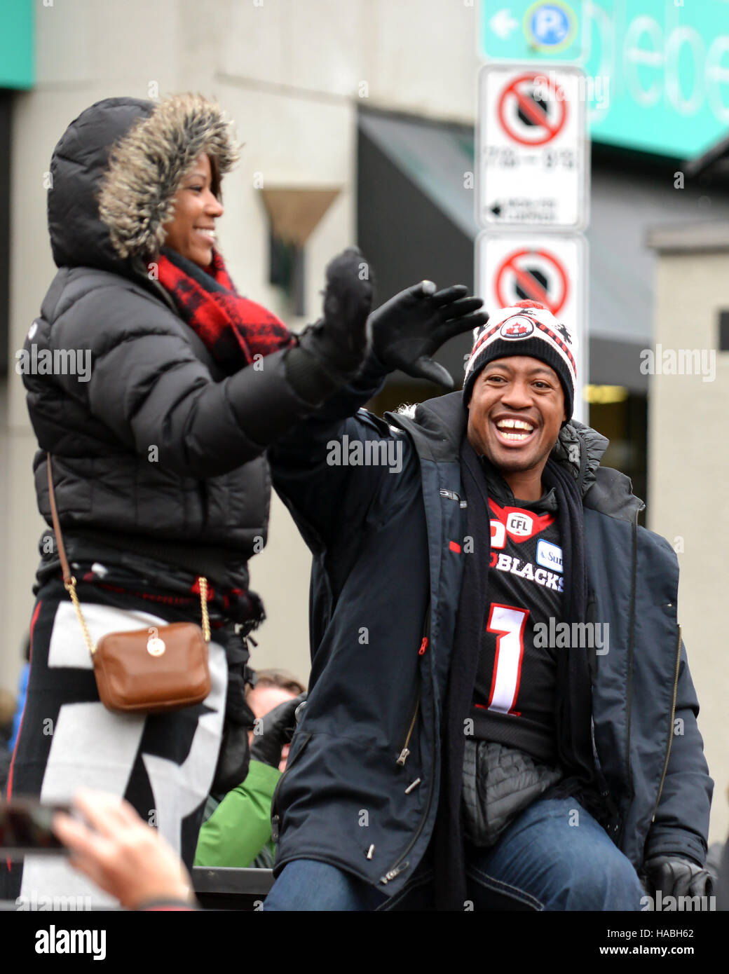 Ottawa, Canada. 29th Nov, 2016. MVP Henry Burris with his family in truck during the Grey Cup Parade at Lansdowne Park.  The 41 year old Quarterback led the Ottawa Redblacks, in only their 3rd season to the city’s first CFL championship in 40 years, with an upset win over the Calgary Stampeders. Credit:  Paul McKinnon/Alamy Live News Stock Photo