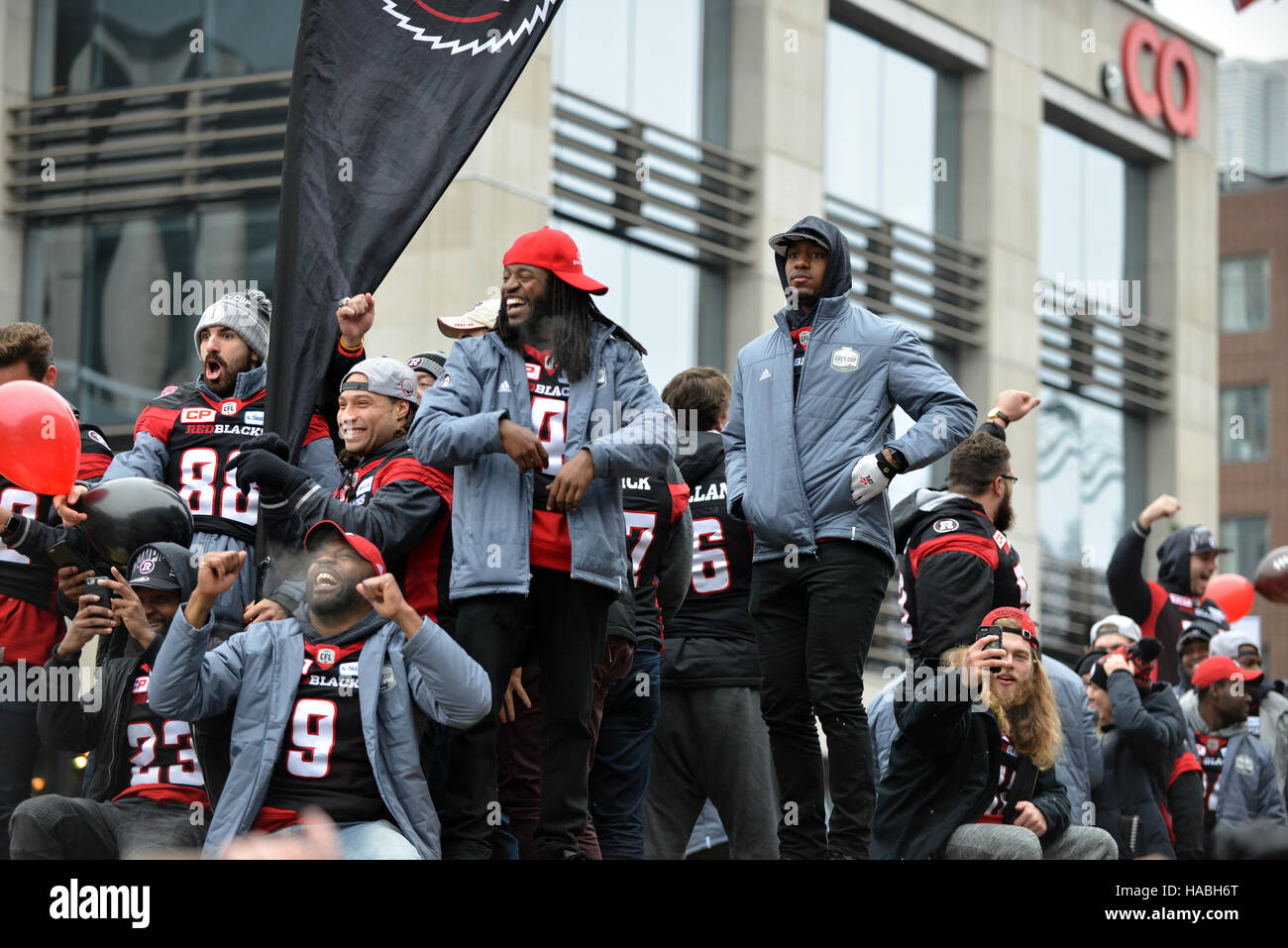 Ottawa, Canada. 29th Nov, 2016. The Ottawa Redblacks during the Grey Cup Parade on Bank Street.  The team, in only their 3rd season, won the city’s first CFL championship in 40 years, with an upset win over the Calgary Stampeders. Credit:  Paul McKinnon/Alamy Live News Stock Photo