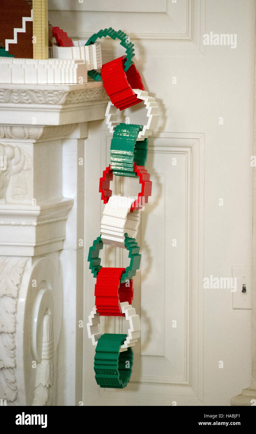 The 2016 White House Christmas decorations are previewed for the press at the White House in Washington, DC on Tuesday, November 29, 2016. On the mantle, a first-of-its-kind LEGO paper chain measuring approximately 18 feet long will hang alongside LEGO “gingerfriends”, built from 4,900 LEGO bricks. The first lady's office released the following statement to describe those decorations, "This year's holiday theme, 'The Gift of the Holidays, ' reflects on not only the joy of giving and receiving, but also the true gifts of life, such as service, friends and family, education, and good health, as  Stock Photo