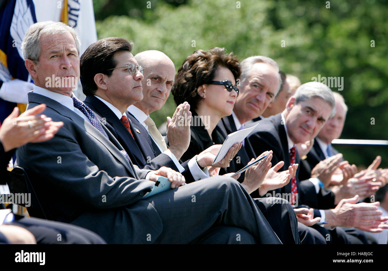From left to right: United States President George W. Bush, U.S. Attorney General Alberto Gonzales, U.S. Secretary for Homeland Security Michael Chertoff, U.S. Secretary of Labor Elaine Chao, U.S. Secretary of the Interior Dirk Kempthorne, and FBI Director Robert Mueller applaud during the Annual Peace Officers Memorial Service on the West Front of the U.S. Capitol in Washington, DC, May 15, 2007. Credit: Joshua Roberts/Pool via CNP /MediaPunch /MediaPunch Stock Photo