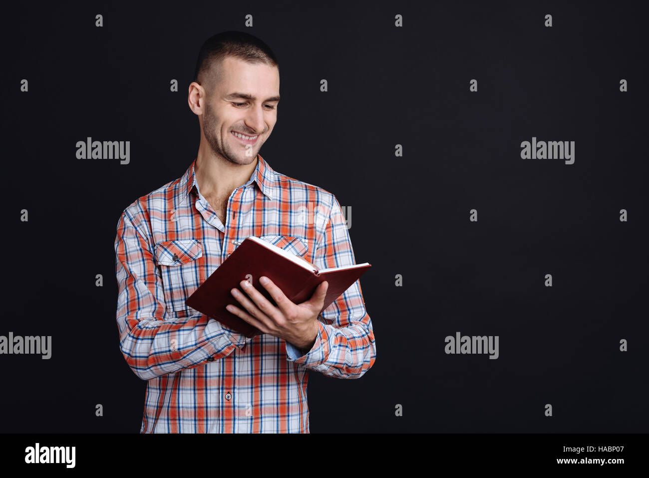Millennial black man reading hi-res stock photography and images - Alamy