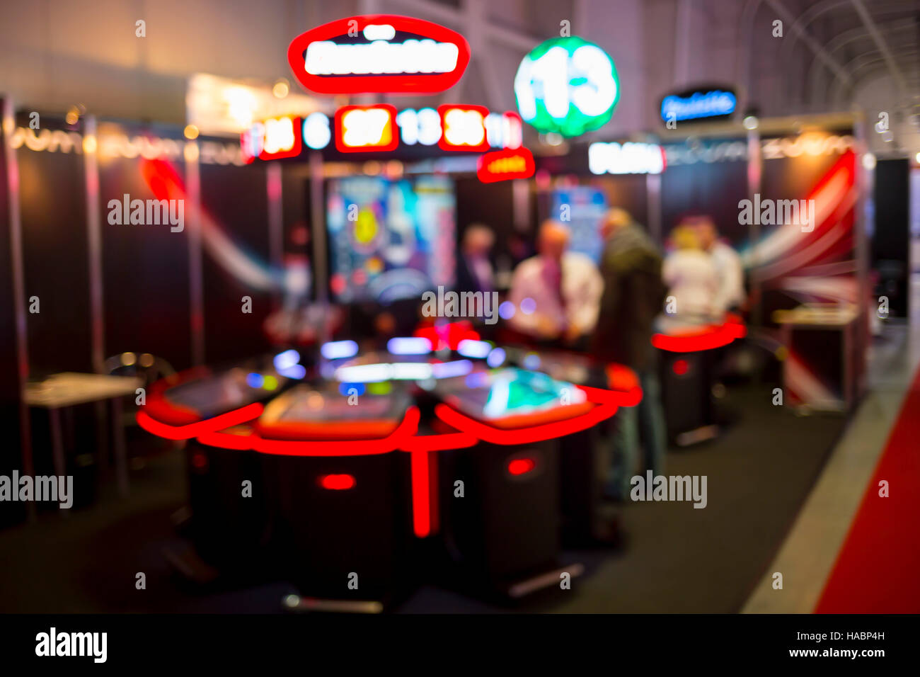 Blurry image of slots machines and other gambling equipment at a casino. Out of focus (bokeh) colourful and high contrast picture in a casino. Stock Photo