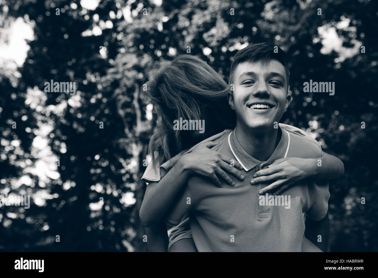 man carries a girl on his back Stock Photo Alamy